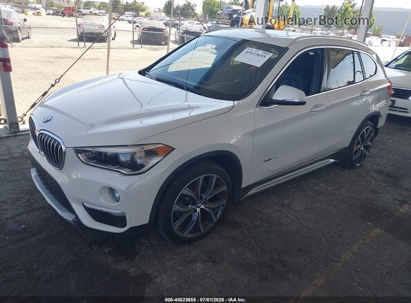 WBXHT3C39G5E47320 2016 BMW X1 White წინა მარცხენა ხედი სამი მეოთხედიდან