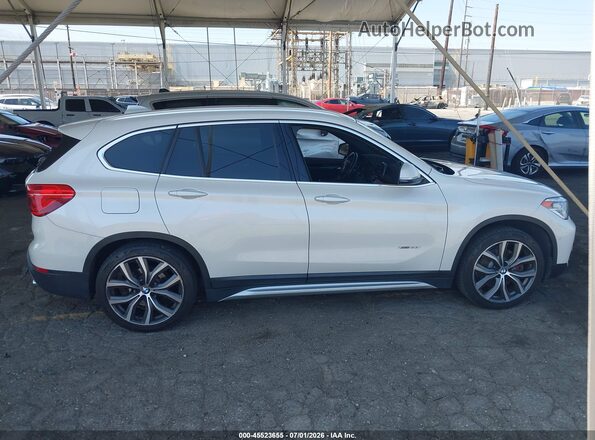 WBXHT3C39G5E47320 2016 BMW X1 White უკანა სალონის ხედი