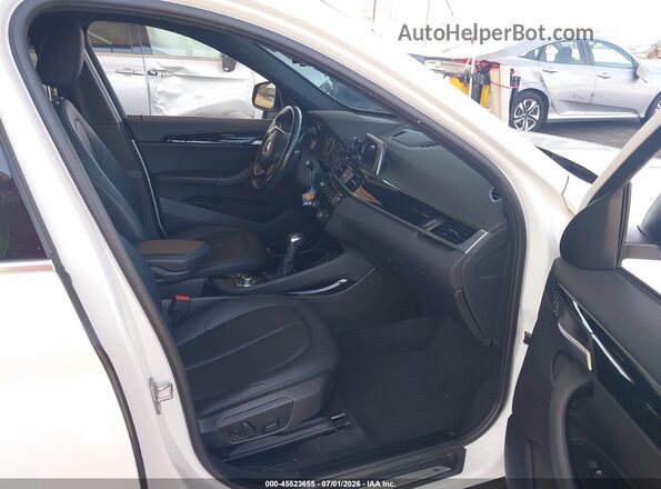 WBXHT3C39G5E47320 2016 BMW X1 White წინა სალონის ხედი