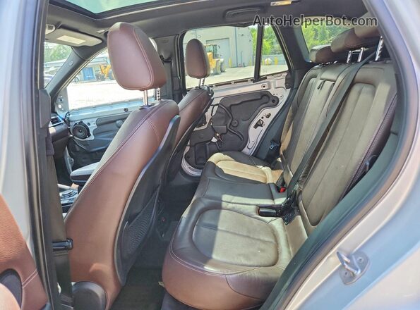 WBXHT3C39G5E48872 2016 BMW X1 Silver Սալոնի հետևի տեսք