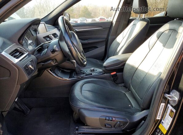 WBXHT3C39G5E54994 2016 BMW X1 Black Front interior view