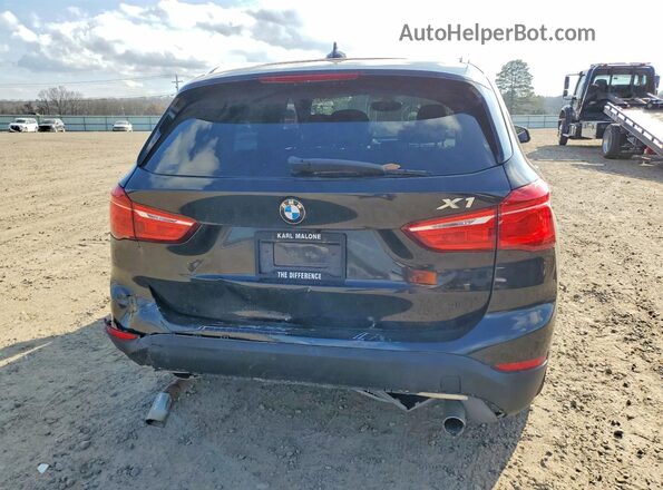 WBXHT3C39G5E54994 2016 BMW X1 Black Rear view
