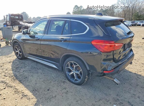 WBXHT3C39G5E54994 2016 BMW X1 Black Rear left