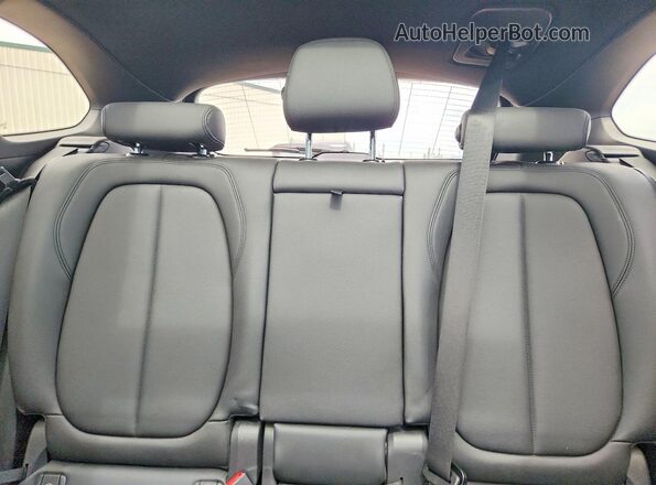 WBXHT3C39G5F63651 2016 BMW X1 Blue Vista de los asientos traseros
