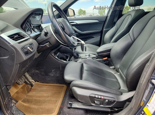 WBXHT3C39G5F63651 2016 BMW X1 Blue Vista interior delantera