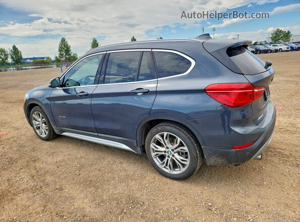 WBXHT3C39G5F63651 2016 BMW X1 Blue Trasero izquierdo