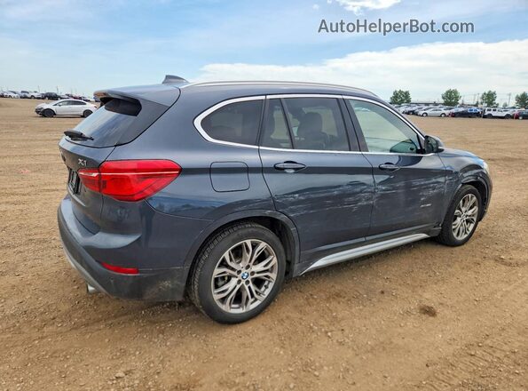 WBXHT3C39G5F63651 2016 BMW X1 Blue Trasero derecho