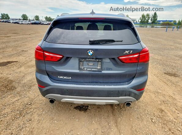 WBXHT3C39G5F63651 2016 BMW X1 Blue Vista trasera