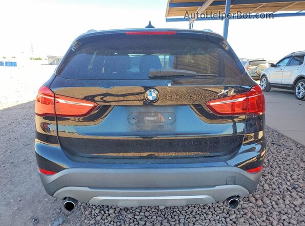 WBXHT3C39GP882128 2016 BMW X1 Black Հետևի տեսք