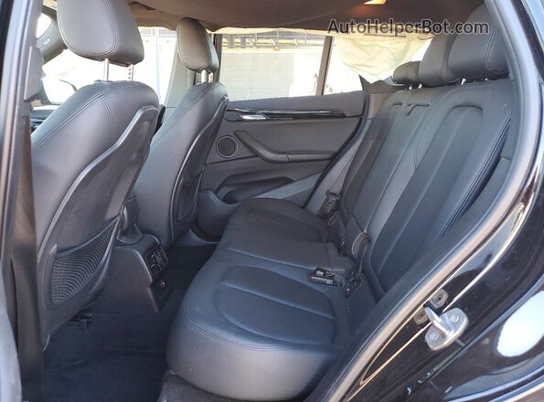 WBXHT3C39GP882128 2016 BMW X1 Black Սալոնի հետևի տեսք