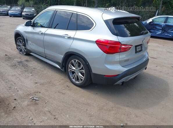 WBXHT3C39H5F68026 2017 BMW X1 Silver Trasero izquierdo