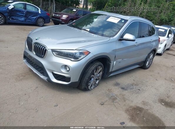 WBXHT3C39H5F68026 2017 BMW X1 Silver Vista tres cuartos delantera izquierda