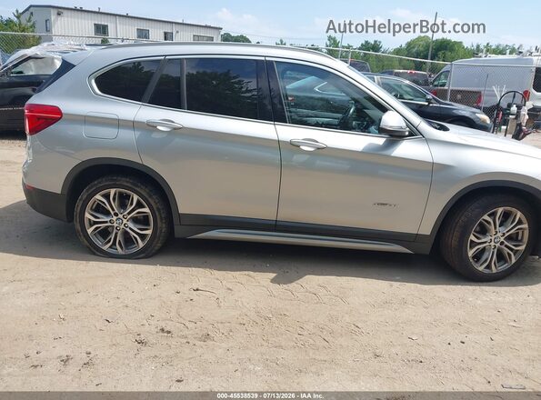 WBXHT3C39H5F68026 2017 BMW X1 Silver Vista interior trasera