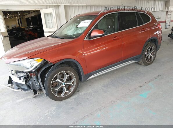 WBXHT3C3XJ5L29782 2018 BMW X1 Orange წინა მარცხენა ხედი სამი მეოთხედიდან