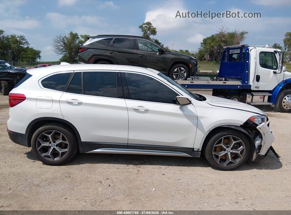 WBXHT3C56K5L38501 2019 BMW X1 White Սալոնի հետևի տեսք