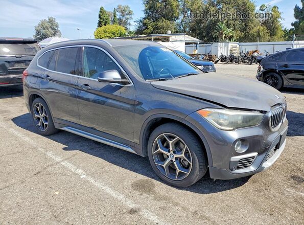 WBXHT3C59K5L89166 2019 BMW X1 Gray Delantero derecho