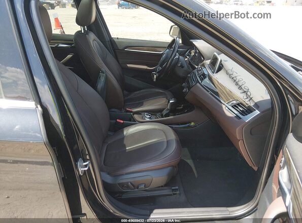 WBXHT3Z35G4A50734 2016 BMW X1 Black Front interior view