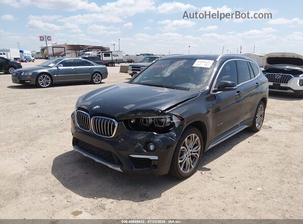 WBXHT3Z35G4A50734 2016 BMW X1 Black Front view