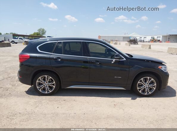 WBXHT3Z35G4A50734 2016 BMW X1 Black Rear interior view