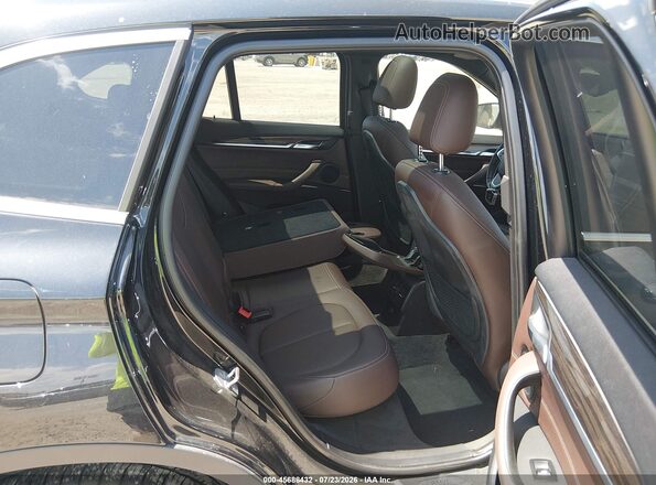 WBXHT3Z35G4A50734 2016 BMW X1 Black VIN sticker view