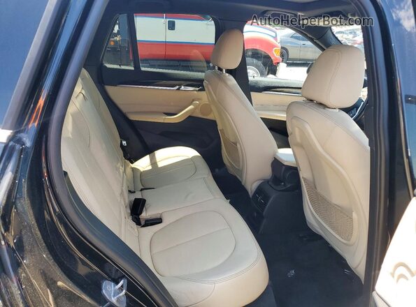WBXHT3Z37G4A50895 2016 BMW X1 Black Vista de los asientos traseros