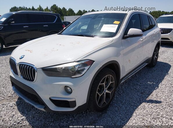 WBXHU7C34J5L08320 2018 BMW X1 White Vista tres cuartos delantera izquierda