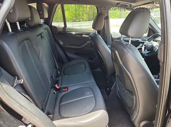 WBXHU7C35H5H37964 2017 BMW X1 Black Rear seats view