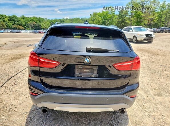 WBXHU7C35H5H37964 2017 BMW X1 Black Rear view