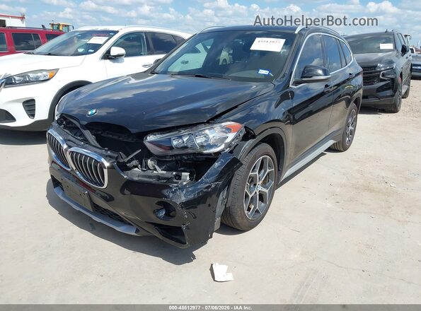 WBXHU7C36J5L09436 2018 BMW X1 Black Vista tres cuartos delantera izquierda