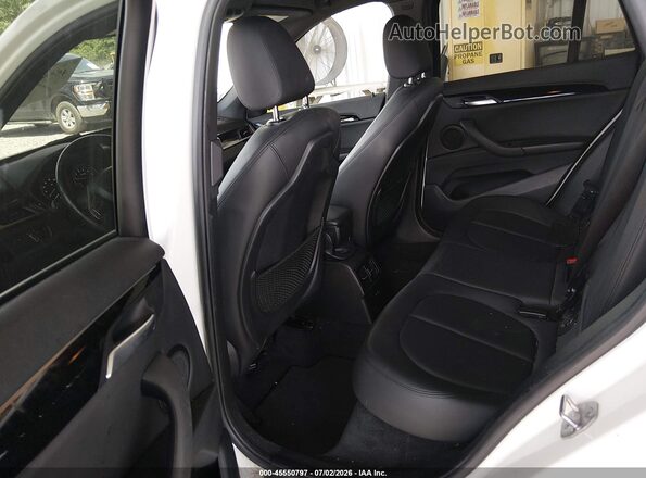 WBXHU7C3XJ3F04566 2018 BMW X1 White VIN sticker view