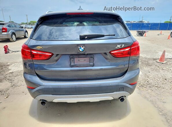 WBXHU7C3XJ5H45838 2018 BMW X1 Gray Vista trasera