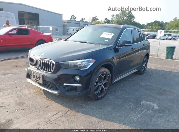 WBXHU7C52K5L10974 2019 BMW X1 Black Առջևի ձախ երեք քառորդ տեսարան