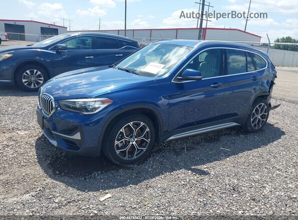 WBXJG9C06M5S10002 2021 BMW X1 Blue წინა მარცხენა ხედი სამი მეოთხედიდან