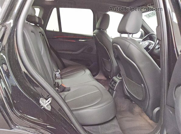 WBXJG9C08L5P87340 2020 BMW X1 Black Vista interior trasera