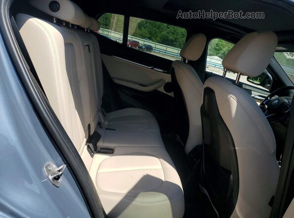 WBXYJ1C08N5U65902 2022 BMW X2 Синий Вид задней части салона