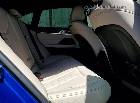 WBY33AW03RFR75330 2024 BMW I4 Blue Rear seats view