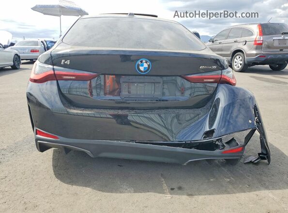 WBY43AW05RFS37324 2024 BMW I4 Black Widok z tyłu