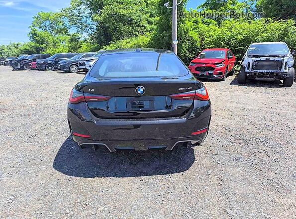 WBY43HD02TFW50837 2026 BMW I4 Black Widok z tyłu