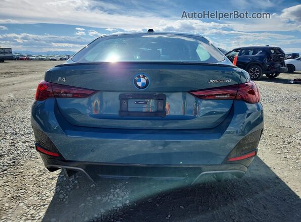 WBY43HD04SFU34048 2025 BMW I4 Green Rear view