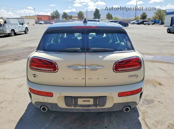 WMWLV7C06M2N42715 2021 MINI COOPER Cream Rear view