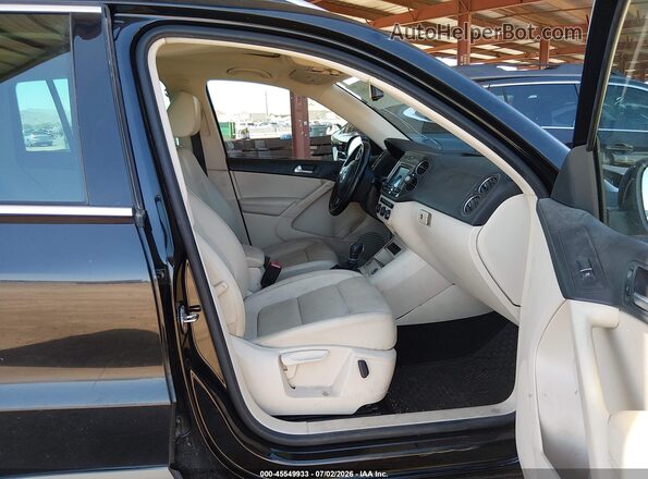 WVGAV7AX8GW501196 2016 VOLKSWAGEN TIGUAN Black Vista interior delantera