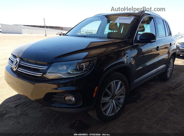 WVGAV7AX8GW501196 2016 VOLKSWAGEN TIGUAN Black Vista tres cuartos delantera izquierda