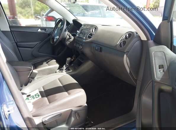 WVGRV7AX2HW507841 2017 VOLKSWAGEN TIGUAN Blue Vista interior delantera