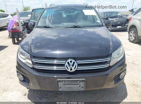WVGTV7AX5HW507306 2017 VOLKSWAGEN TIGUAN Black Vista interior trasera