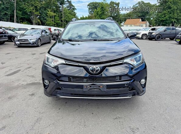 2T3RFREV4JW857885 2018 TOYOTA RAV4 Black Widok wnętrza z przodu