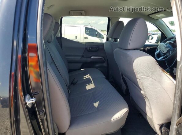 3TMCZ5AN7PM548983 2023 TOYOTA TACOMA Black Rear interior view