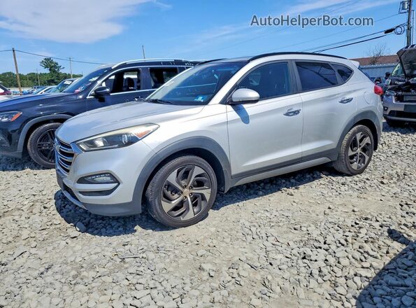 KM8J3CA25HU294329 2017 HYUNDAI TUCSON Silver Trasero izquierdo