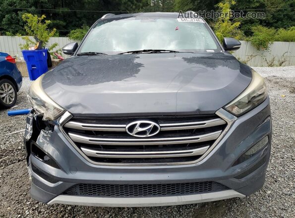 KM8J33A23HU352289 2017 HYUNDAI TUCSON Gray Rear view