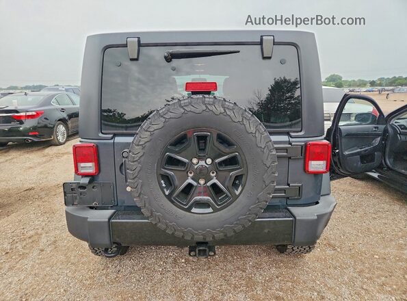 1C4BJWDG4GL216023 2016 JEEP WRANGLER Gray Rear view