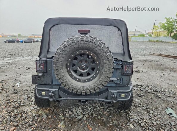 1C4BJWDG6GL231588 2016 JEEP WRANGLER Black Widok z tyłu